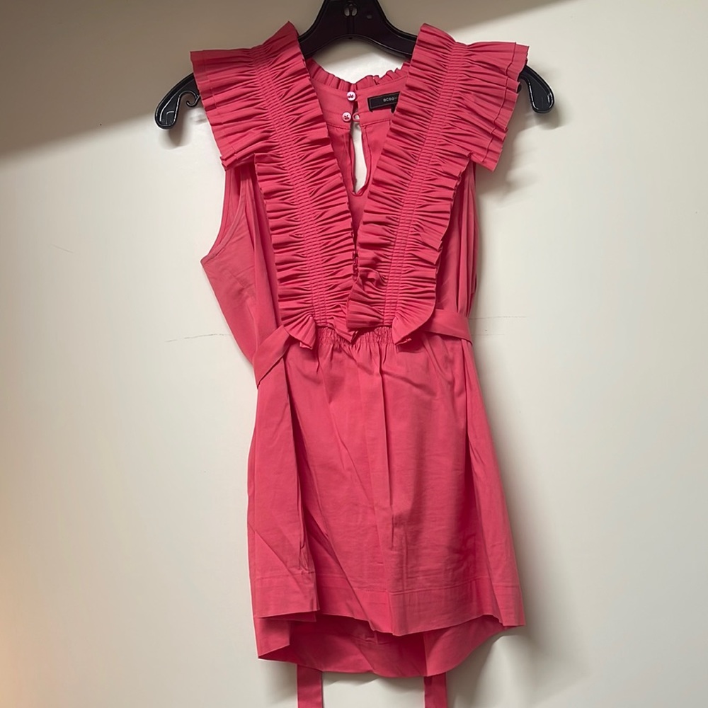 BCBG darling, ruffle top that ties at back perfect with jeans or a skirt
